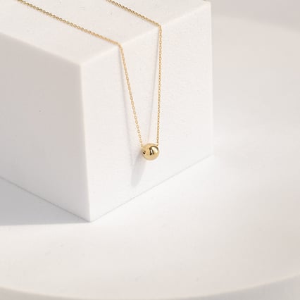 Goldenes Schmuckset mit Kugeln Juelz