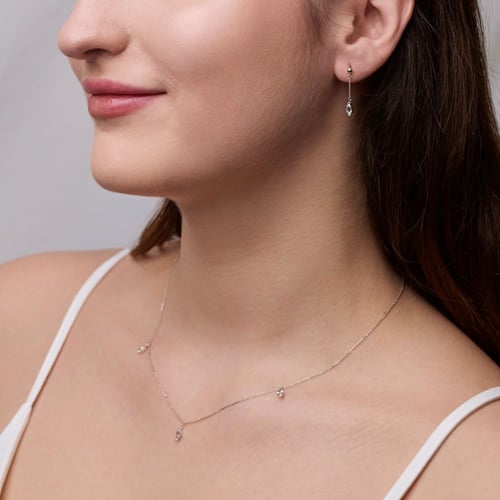 Goldene Hängeohrringe mit weißem Topas Maritza