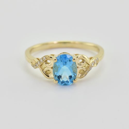 Goldring mit Blautopas und Diamanten Alanyse