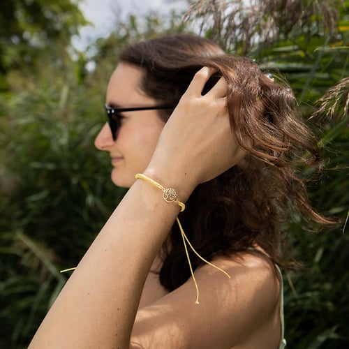 Armband mit einem Anhänger in Form des Lebensbaums Wicks