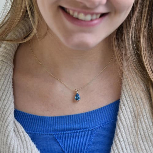 Goldener Anhänger mit Träne aus Topas und Diamant Raulla