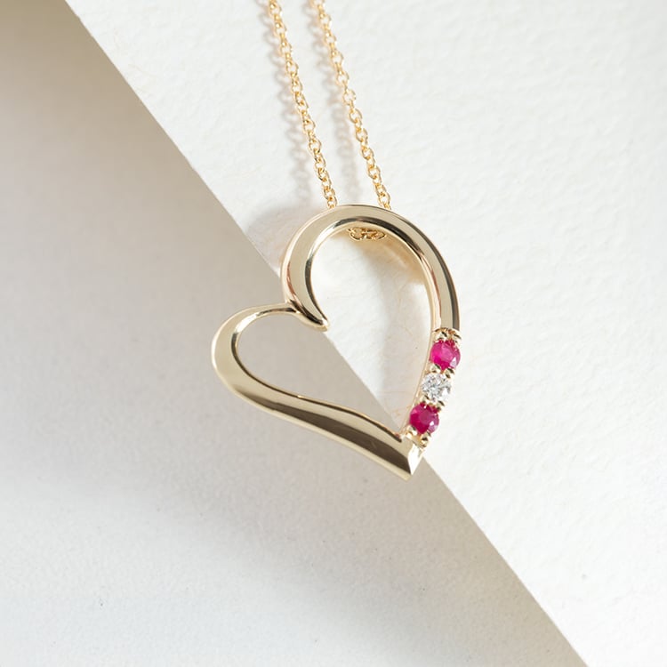Goldene Anhänger in Herz-Form mit Rubinen und Diamanten Tanish 149035