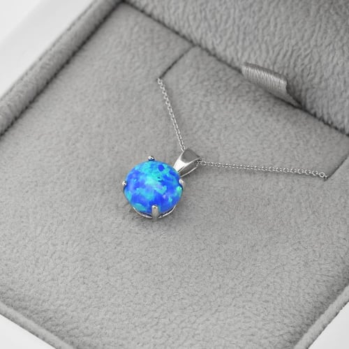 Blauer Opal im goldenen Anhänger Icy