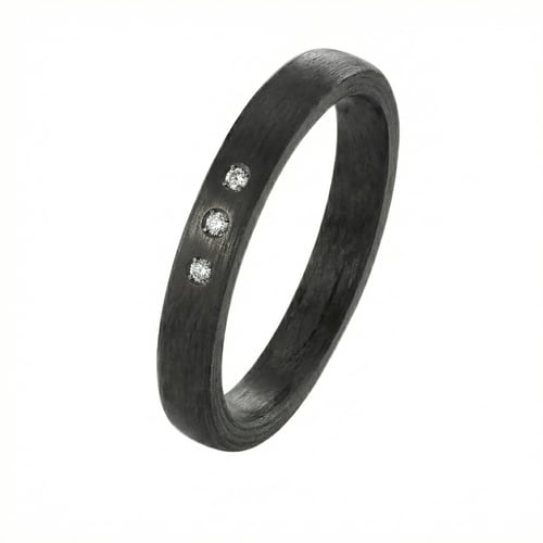 Flache Eheringe aus Carbon mit Diamant Dammu