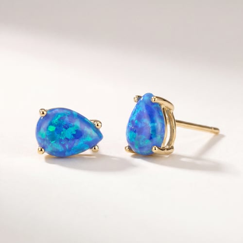 Goldene Ohrringe mit blauen Opalen Reata