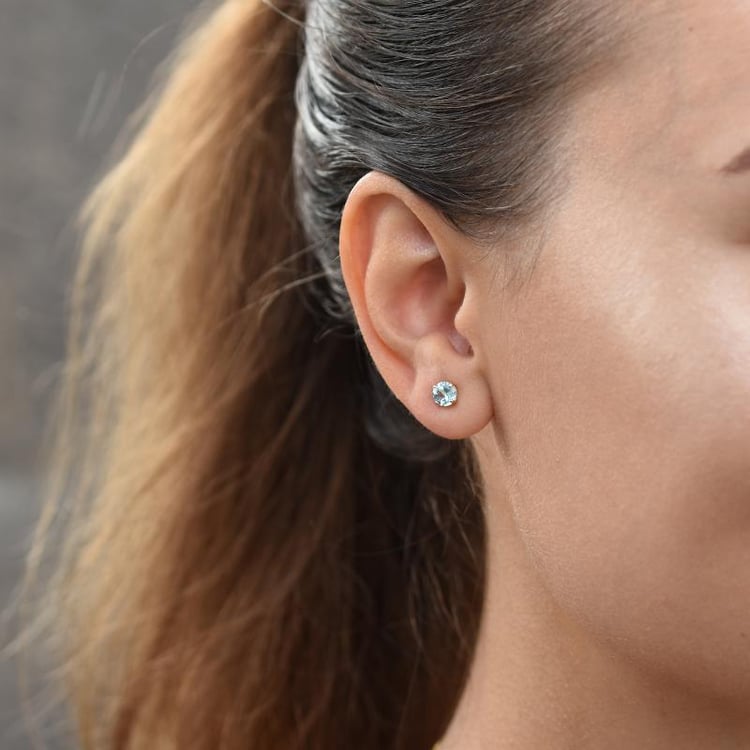 Goldene Ohrringe mit Topasen 55343