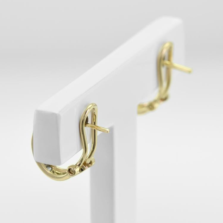 Elegante goldene Ohrclips mit Baguette-Diamanten Emy 47244