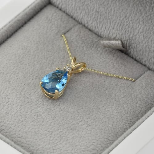 Goldener Anhänger mit Träne aus Topas und Diamant Raulla