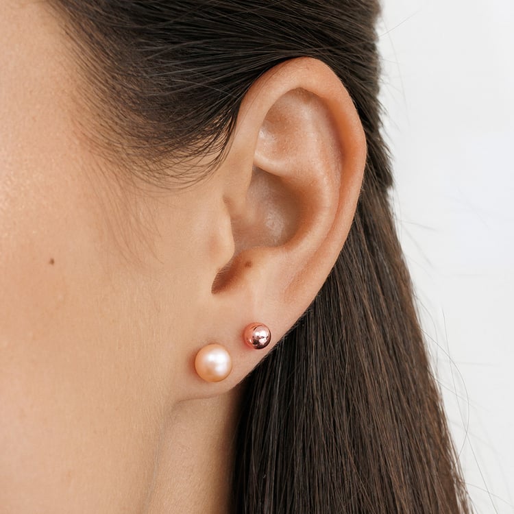 Silberne Ohrringe mit pfirsichfarbenen Perlen 158396