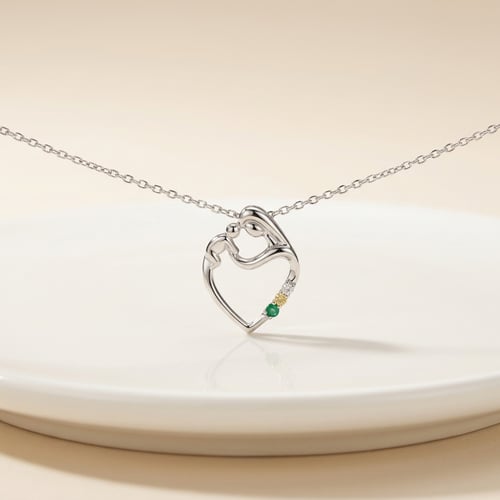 Silberner Anhänger Mutter und Kind mit Saphir, Smaragd und Salt-and-Pepper Diamanten Eisa