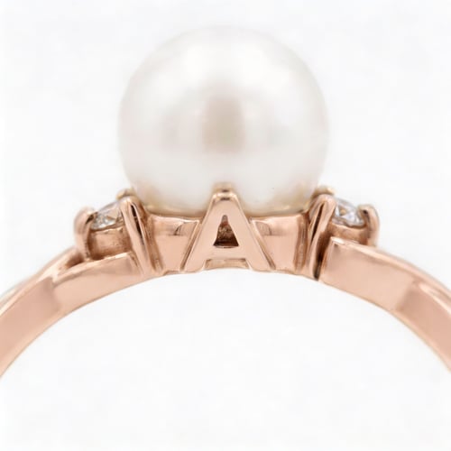 Eleganter Goldring Buchstaben und Perle und Diamanten Azana