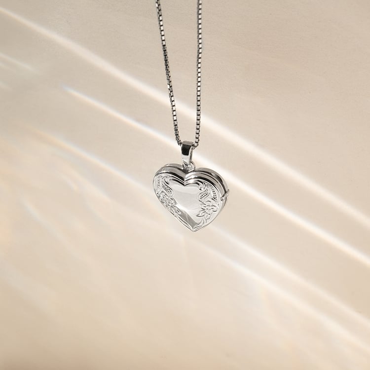 Silbernes Medaillion in Herzform zum Öffnen 140323