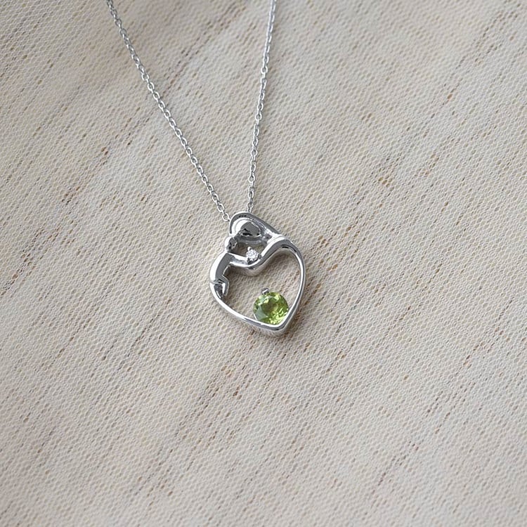 Mutter und Kind Anhänger mit Olivin und Diamanten 68846