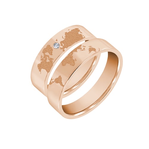 Goldene Trauringe mit Gravur der Weltkarte und Diamant Zeoni