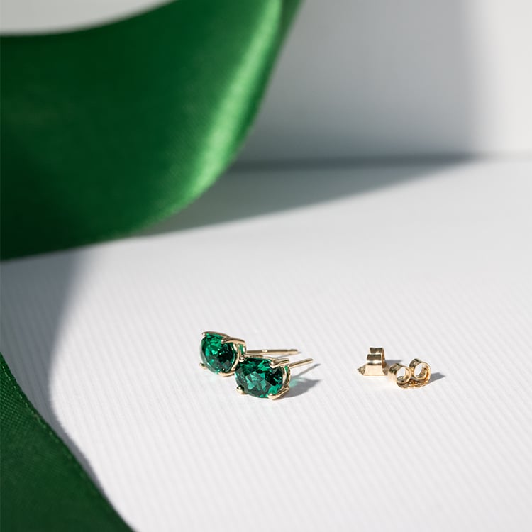 Goldene Ohrringe mit ovalen Smaragden Qati 121892