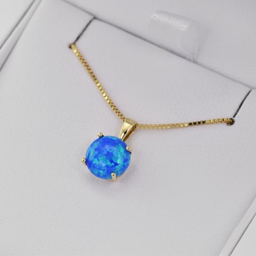 Blauer Opal im goldenen Anhänger Icy