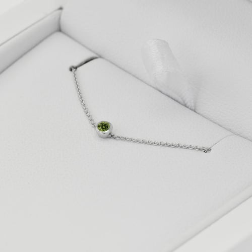 Minimalistisches Armband aus Platin mit grünem Diamant Bonato