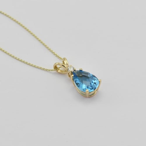 Goldener Anhänger mit Träne aus Topas und Diamant Raulla