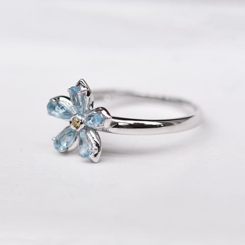 Verlobungsring mit Topasen und Diamanten Zusia