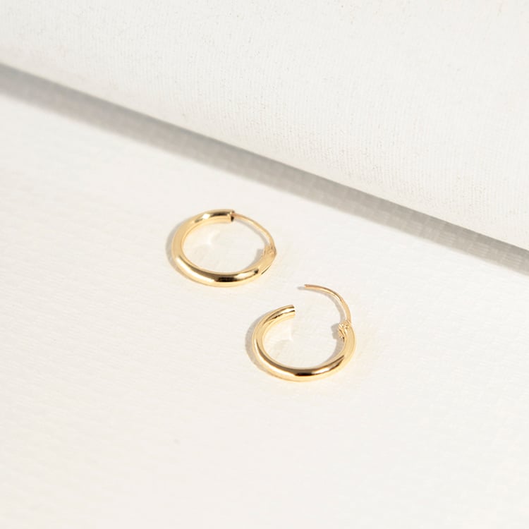 Goldene runde Ohrringe 108174