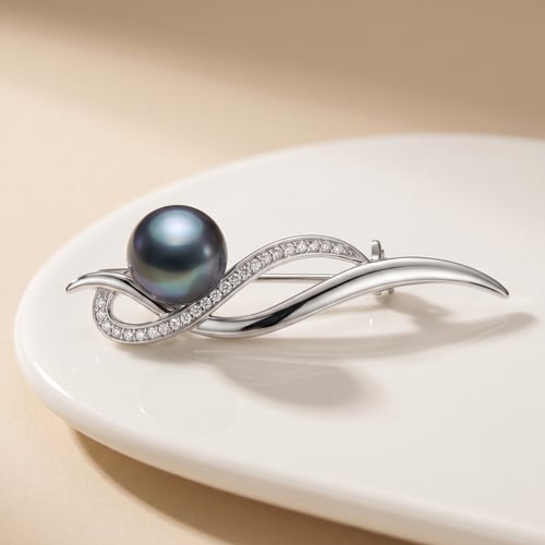 Silberne Brosche mit schwarzer Perle und Zirkonia Otmar