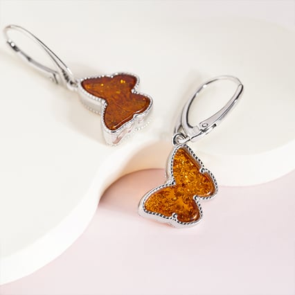 Silberne Ohrringe mit Schmetterlingen aus Bernstein Blicas