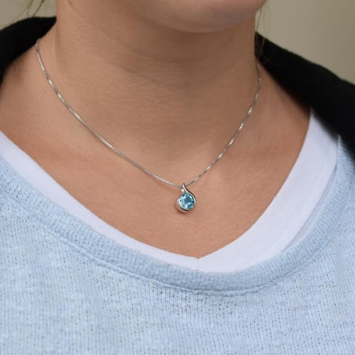 Silberne Anhänger mit Topas Thirumal