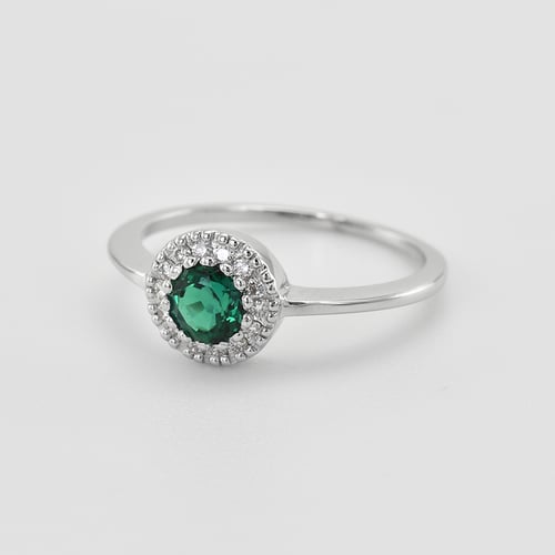 Goldener Halo Ring mit Smaragd umgeben von Diamanten Tafne