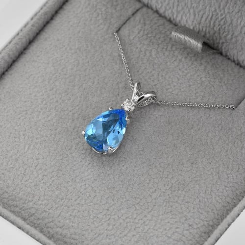 Goldener Anhänger mit Träne aus Topas und Diamant Raulla