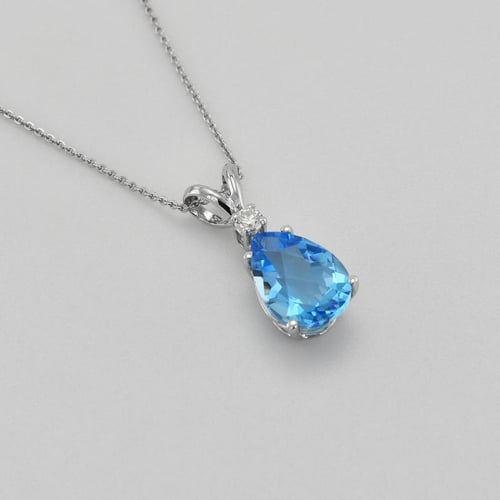 Goldener Anhänger mit Träne aus Topas und Diamant Raulla