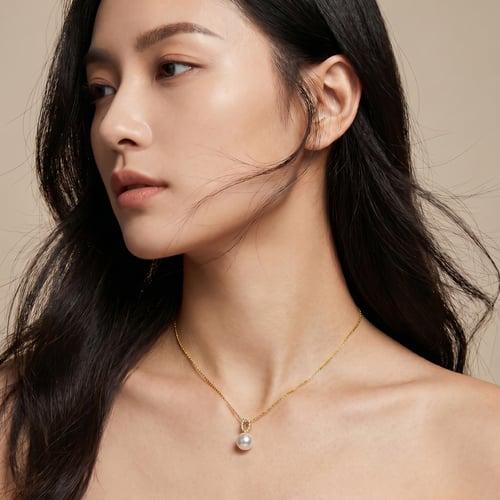 Eleganter goldener Anhänger mit Perle und Zirkonia Nana