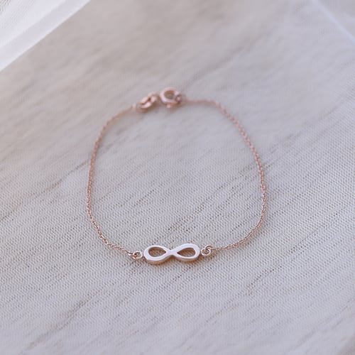 Schmuckset aus Gold mit Unendlichkeitszeichen Infinity