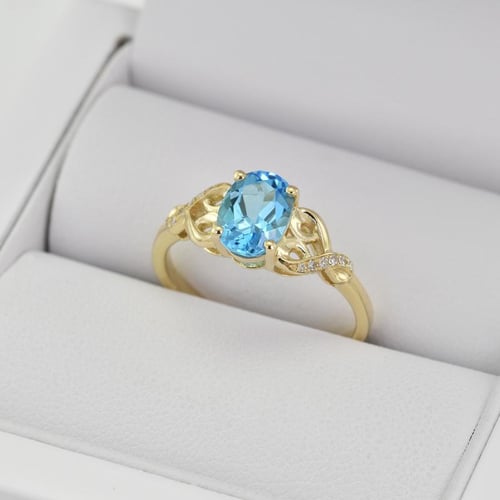 Goldring mit Blautopas und Diamanten Alanyse