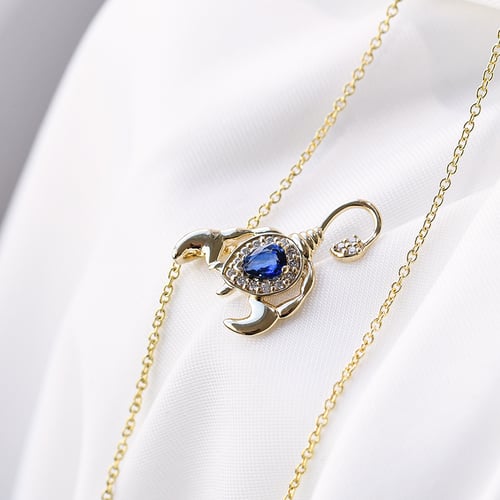 Goldener Anhänger mit Saphir und Diamanten im Sternzeichen Skorpion Escorpion