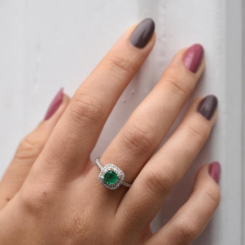 Ring aus zwei Goldarten mit Smaragd und Diamanten Vicente