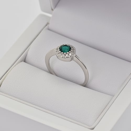 Goldener Halo Ring mit Smaragd umgeben von Diamanten Tafne
