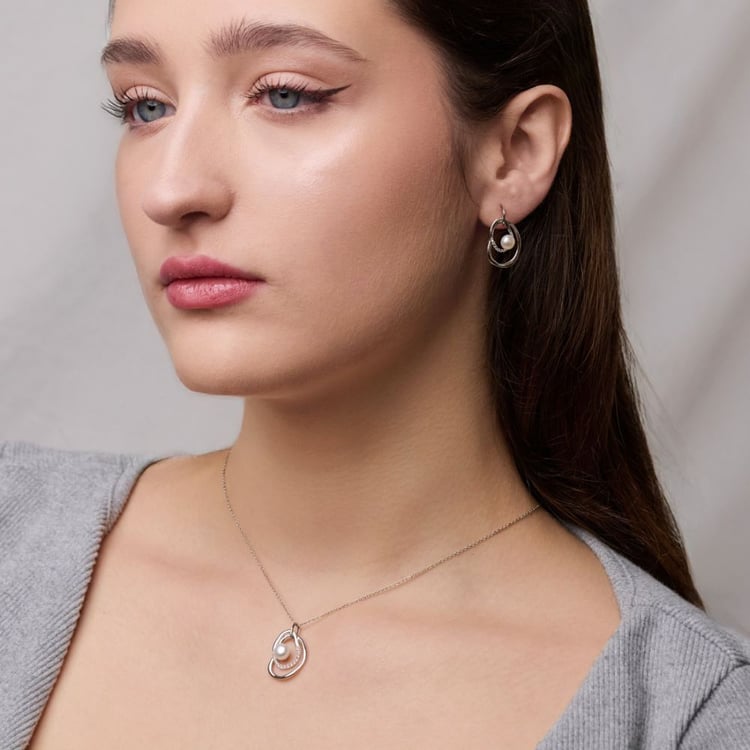 Silbernes Schmuckset mit Perlen und weißen Topasen 164072