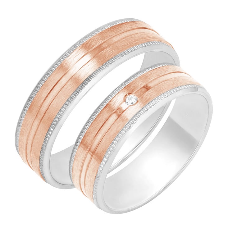 Zarte Eheringe mit einem Diamanten Cupid