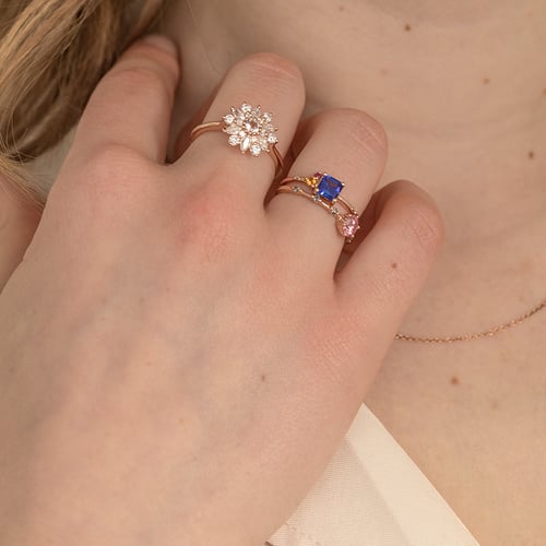 Cluster-Ring mit einem Asscher Tansaniten, Padparadscha-Saphir, Rubin und Diamant Kenny