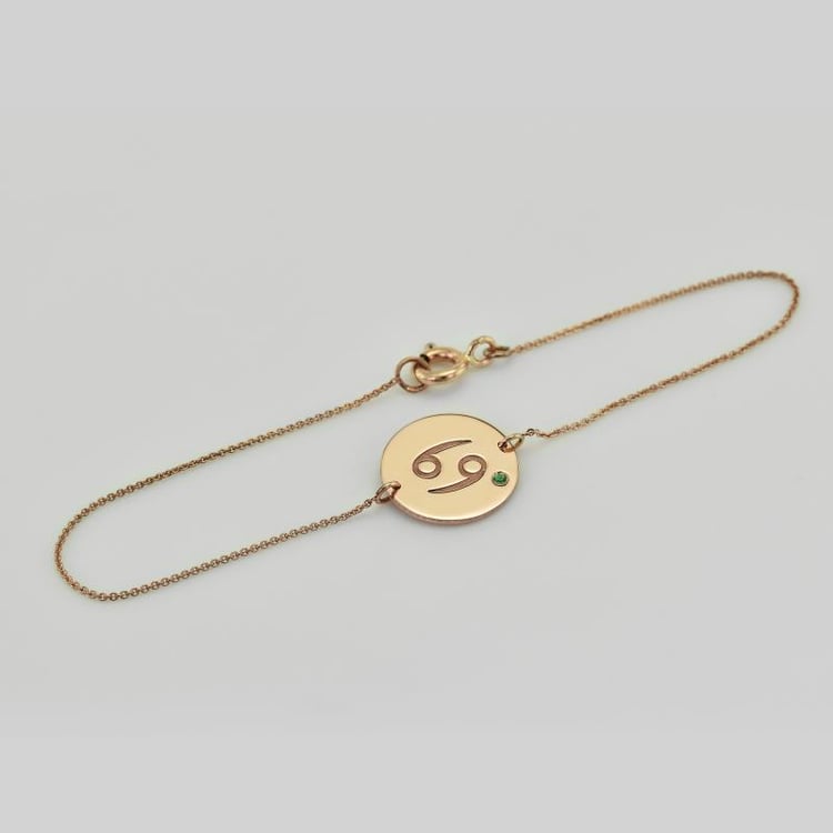 Goldenes Plättchen mit Krebs Sternzeichen und Smaragd 37721