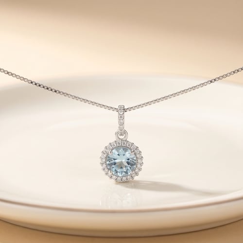 Silberne Halo-Anhänger mit himmlisch blauen Topas Atia