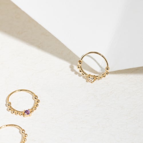 Goldenes Septum Piercing mit weißen Topasen Arla