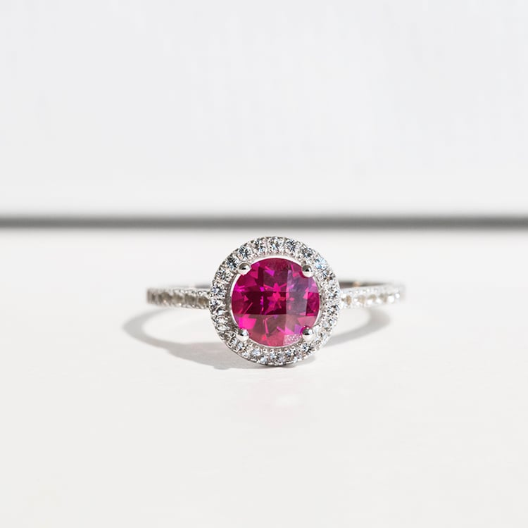 Ring aus Gold im Halo-Stil mit Rubin und Topasen Maala 114339