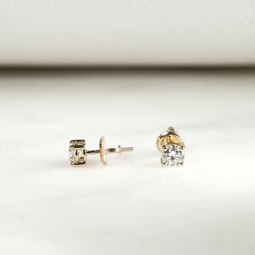 Ohrringe mit Diamanten und vier Krappen Christi