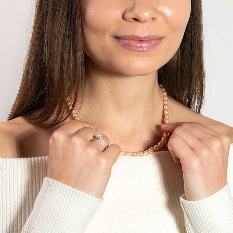 Kette mit pfirsichfarbenen Perlen Faust 149985