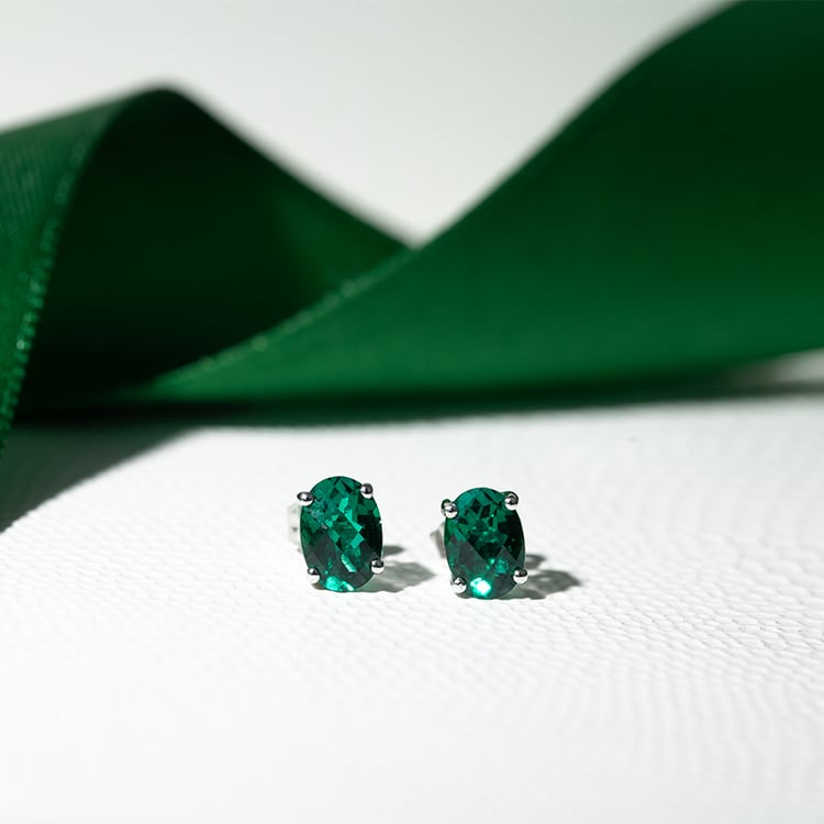 Goldene Ohrringe mit ovalen Smaragden Qati 130468