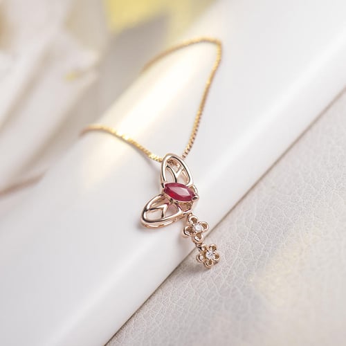 Goldener Anhänger mit Rubinen und Diamanten Papillon