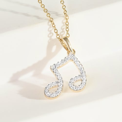 Anhänger aus Gold mit Diamanten in Form einer Note Ariel