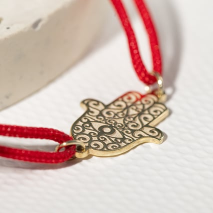 String Armband mit dem Symbol Hamsa