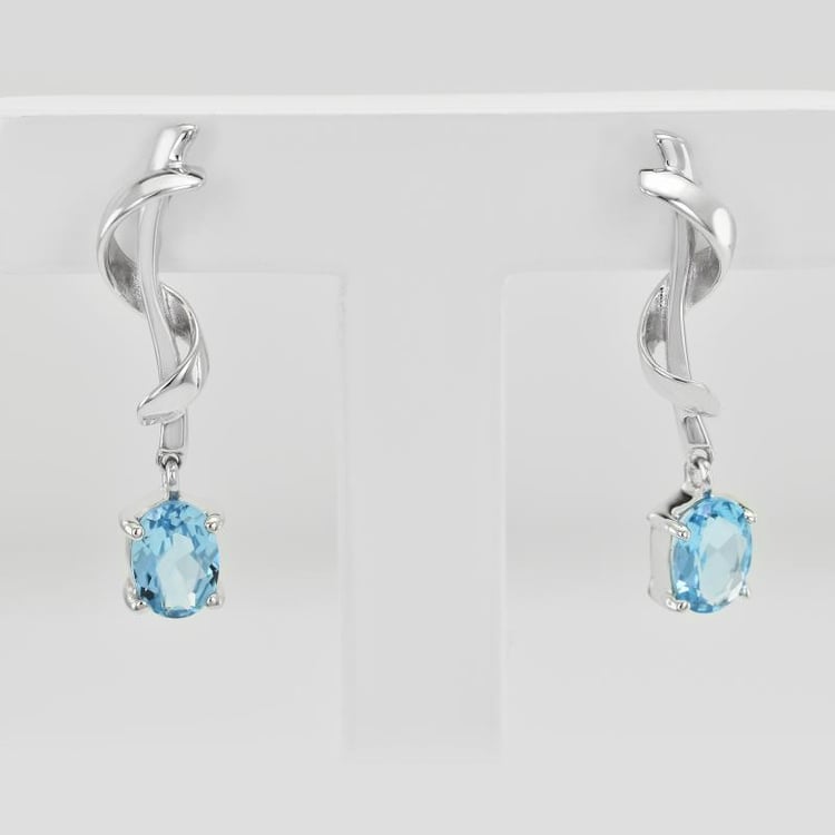 Silberne Ohrringe mit oval Topasen 25102